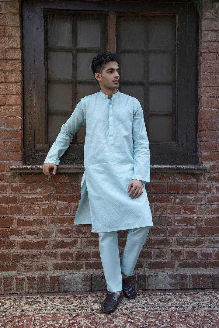 The Kurta-Trouser Suit
Short Kurta, cut above the knee, paired with the Straight-leg Trouser. This signature Kurta Trouser is crafted from 100% fine Cotton
with a silhouette that is a combination of modern-day panache and classic refinement.